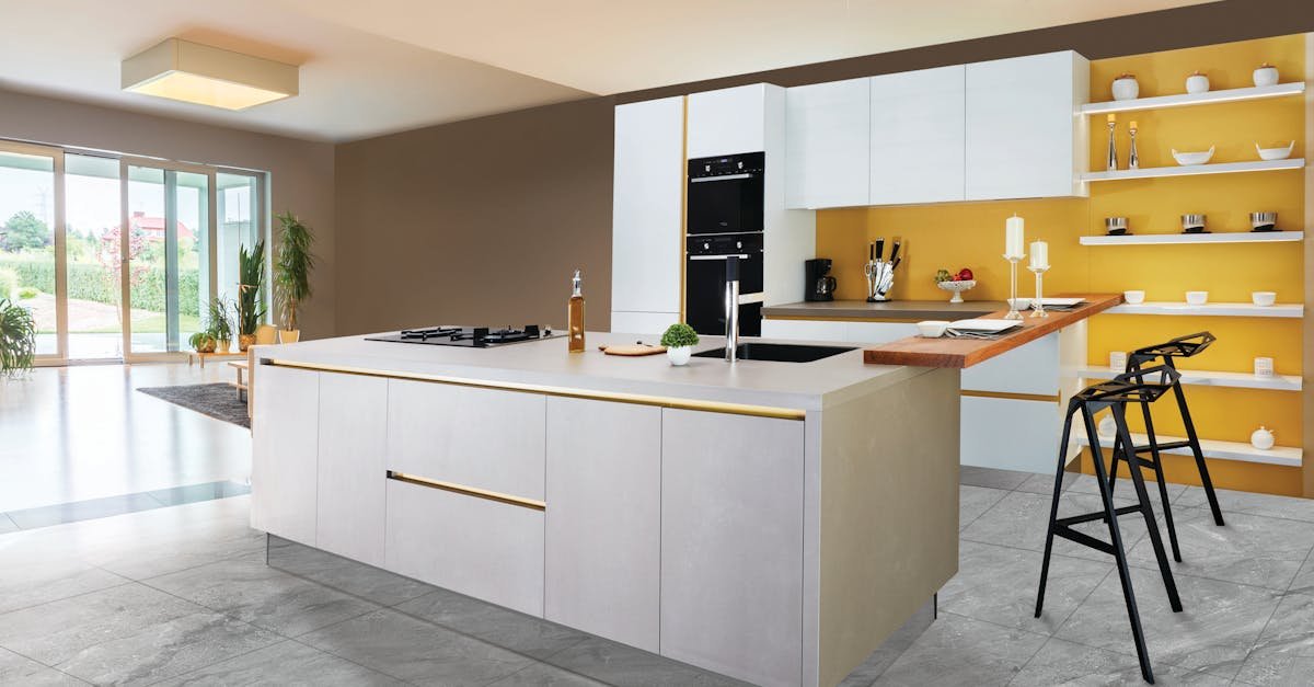 pexels-photo-2089698-2089698 Sleek and modern kitchen interior featuring a large island and open shelving in a contemporary setting.