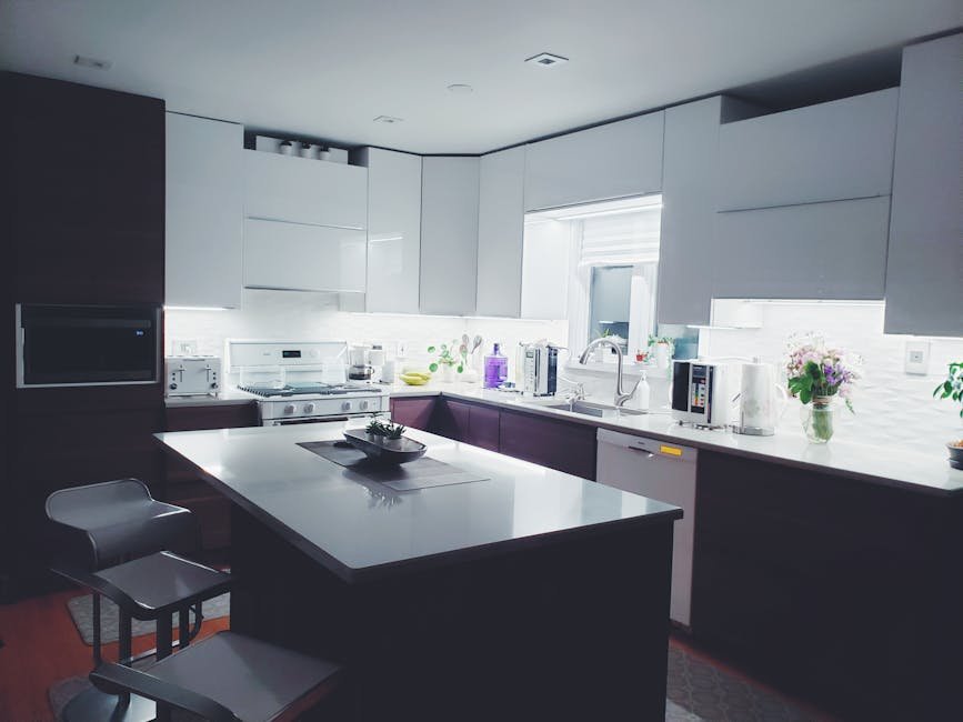 pexels-photo-2398375-2398375 Contemporary kitchen interior with sleek white cabinets and island, perfect for a minimalist aesthetic.